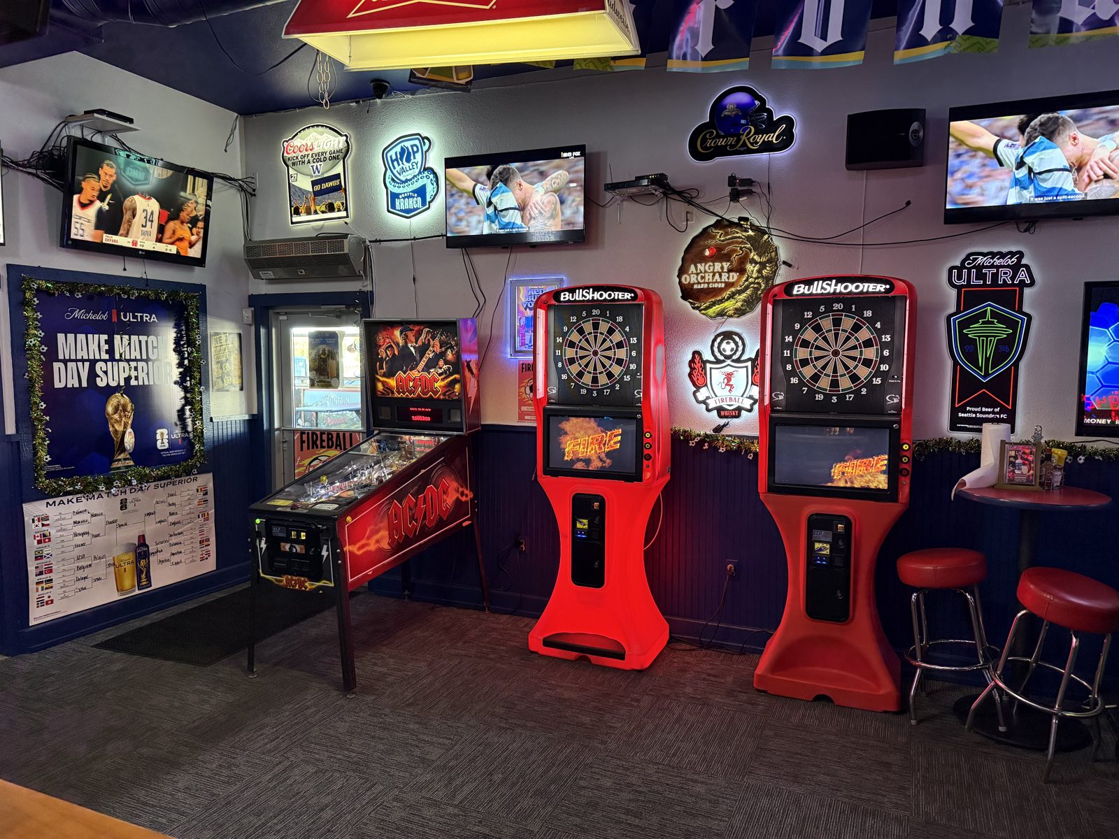 Games area with AC/DC pinball and electronic darts at Sam's Saloon in Kennewick, WA